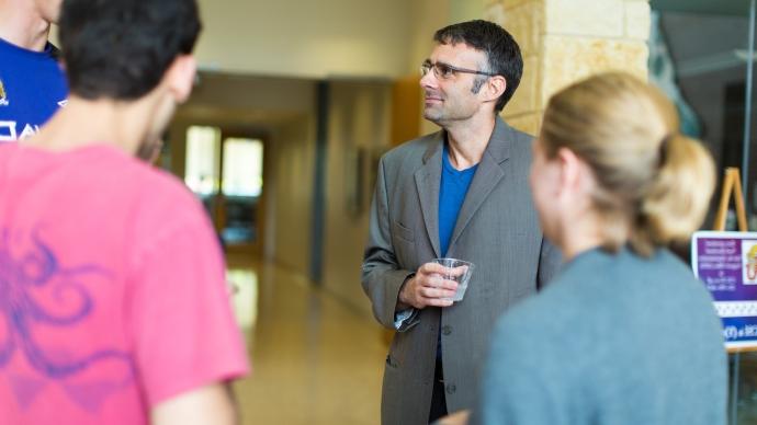 Bert chandler standing with chemistry students at the chemistry awards